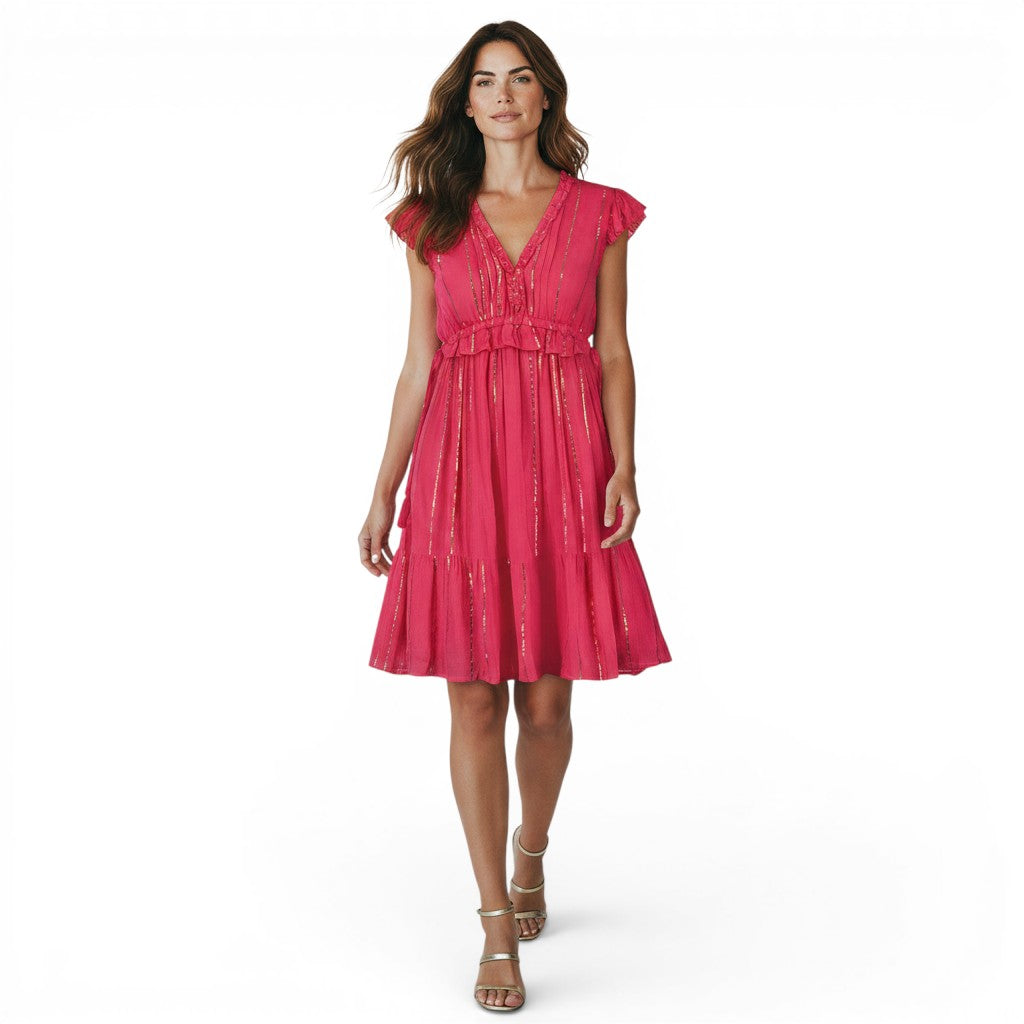Coralie Women's Mini Dress in Fuchsia Lurex by Mer St. Barth. Features ruffled neckline, cinched waist, and tiered skirt with gold stripes.