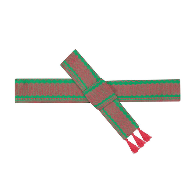 Mer St. Barth Emerald Bloom woven cotton belt with red tassels and green zigzag pattern.
