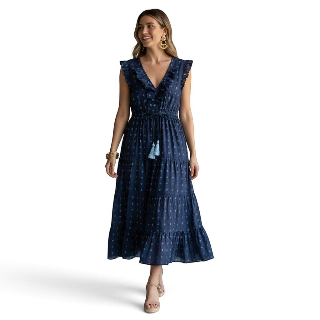 Mer St. Barth Giselle navy and turquoise Swiss dot maxi dress with ruffle neckline, flutter sleeves, and tassel tie.