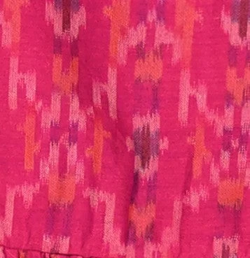 Mer St. Barth Daphne flutter sleeve dress in a vibrant pink and orange rosette ikat print fabric