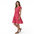 Mer St. Barth Coralie fuchsia lurex mini dress with ruffled neckline and sleeves, cinched waist, and tassel details.