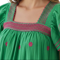 Mer St. Barth green cotton mini dress with square neckline, embroidered trim, and floral details. Flutter sleeves.